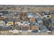 Expansive aerial view highlighting a diverse neighborhood with neat yards and orderly street design at 4540 Crestone Peak St, Brighton, CO 80601