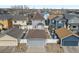 Aerial view of a neighborhood showcasing well-maintained homes, fenced yards, and a tidy street layout at 4540 Crestone Peak St, Brighton, CO 80601