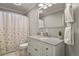 Bathroom with white vanity, shower and tub, mirror and accents provide a clean and refreshing experience at 4540 Crestone Peak St, Brighton, CO 80601