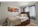 Inviting bedroom featuring a wooden bed frame, comfortable bedding, and warm neutral colors, perfect for relaxation at 4540 Crestone Peak St, Brighton, CO 80601