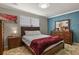 Bedroom boasts stylish decor, a comfortable bed with wooden furnishings, and an inviting atmosphere at 4540 Crestone Peak St, Brighton, CO 80601