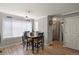 Well-lit dining area features a modern light fixture and 