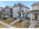 Charming two-story home with a welcoming front porch, neat landscaping, and neutral-colored siding at 4540 Crestone Peak St, Brighton, CO 80601