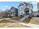 Charming two-story home with blue siding, complemented by a well-maintained lawn and inviting front entrance at 4540 Crestone Peak St, Brighton, CO 80601