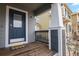 Charming front porch welcomes you with 'hello' mat, columns, and a view of the neighborhood at 4540 Crestone Peak St, Brighton, CO 80601