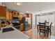 Bright kitchen with stainless steel appliances, wooden cabinets, and wood flooring creates an inviting culinary space at 4540 Crestone Peak St, Brighton, CO 80601