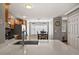 Modern kitchen featuring wood cabinets, stainless steel appliances, and a breakfast bar with seating at 4540 Crestone Peak St, Brighton, CO 80601
