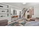 Open-concept layout with the living room flowing into the staircase, creating a cohesive and spacious feel at 4540 Crestone Peak St, Brighton, CO 80601