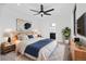 Well-lit bedroom with a ceiling fan and stylish decor at 1258 Yates St, Denver, CO 80204