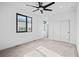 Well-lit bedroom featuring a carpeted floor, window, and closet at 1258 Yates St, Denver, CO 80204