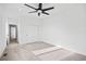 Bright bedroom with a ceiling fan, carpeted floor, and closet at 1258 Yates St, Denver, CO 80204