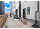 Modern home exterior featuring a black front door, sleek design, and contemporary curb appeal at 1258 Yates St, Denver, CO 80204