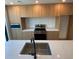 Bright kitchen featuring modern wood cabinets, stainless steel appliances, and a large kitchen island at 1258 Yates St, Denver, CO 80204