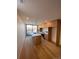 Expansive kitchen with light wood cabinets, stainless appliances, island, and great natural lighting at 1258 Yates St, Denver, CO 80204