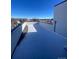 Wide open rooftop featuring deck flooring and surrounding city views on a beautiful, sunny day at 1258 Yates St, Denver, CO 80204