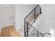 Staircase with carpeted steps and a modern railing, leading to the upper level at 1258 Yates St, Denver, CO 80204