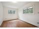 Bedroom with hardwood floors and natural light from the two windows at 20425 Flint Ln, Morrison, CO 80465