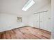 Bright bedroom with hardwood floors, a skylight, and a closet at 20425 Flint Ln, Morrison, CO 80465