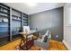 Stylish home office features custom built-in shelving, modern decor, and ample natural light at 20425 Flint Ln, Morrison, CO 80465