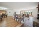Bright and open living room with hardwood floors, fireplace, and large windows offering scenic views at 20425 Flint Ln, Morrison, CO 80465