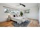 Bright primary bedroom showcasing large windows with wooded views at 20425 Flint Ln, Morrison, CO 80465