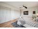 Primary bedroom features multiple closets, wood floors, and horse art at 20425 Flint Ln, Morrison, CO 80465