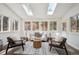 Bright sunroom with skylights, white shiplap walls, and cozy seating area for relaxation at 20425 Flint Ln, Morrison, CO 80465