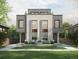 Contemporary duplex featuring a symmetrical design, large windows, and a well-manicured lawn at 451 Harrison St, Denver, CO 80206