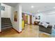 Finished basement with stained concrete floors, wooden sliding doors, and a cozy seating area at 8256 E 28Th Dr, Denver, CO 80238