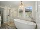 Spa-like bathroom with soaking tub and walk-in shower at 8256 E 28Th Dr, Denver, CO 80238