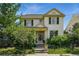 Charming two-story home with a landscaped front yard, steps and beautiful plants in a vibrant neighborhood at 8256 E 28Th Dr, Denver, CO 80238