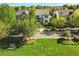 Charming home featuring a green lawn, mature trees, and welcoming front porch at 8256 E 28Th Dr, Denver, CO 80238