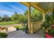 View of the open porch with decorative potted plants and columns at 8256 E 28Th Dr, Denver, CO 80238