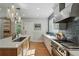 Modern kitchen with quartz countertops, stainless appliances and an eat-in island at 8256 E 28Th Dr, Denver, CO 80238