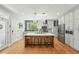 Modern kitchen with quartz countertops, stainless appliances, eat-in island and lots of storage at 8256 E 28Th Dr, Denver, CO 80238
