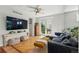 Bright living room features hardwood floors, modern furnishings and a sliding glass door at 8256 E 28Th Dr, Denver, CO 80238