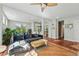Open living space with hardwood floors, large sofa and lots of natural light at 8256 E 28Th Dr, Denver, CO 80238