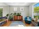 Inviting living area with hardwood floors and large windows at 8256 E 28Th Dr, Denver, CO 80238