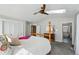 Spacious primary bedroom with a skylight, ceiling fan, and carpeted floors at 8256 E 28Th Dr, Denver, CO 80238