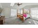 Bright and airy bedroom with skylight and vaulted ceiling at 8256 E 28Th Dr, Denver, CO 80238