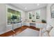 Functional home office with a large desk, built-in storage, and ample natural light at 8256 E 28Th Dr, Denver, CO 80238