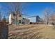 Spacious backyard with mature trees, offering plenty of room for outdoor activities and relaxation at 335 Tynan Dr, Erie, CO 80516