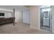 Finished basement with neutral carpet, featuring a view to a powder room, and storage at 335 Tynan Dr, Erie, CO 80516