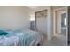 Cozy bedroom with closet and soft lighting providing a relaxing retreat at 335 Tynan Dr, Erie, CO 80516