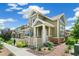 Charming home with a well-manicured lawn, stone accents, and a inviting front porch at 1190 Telleen Ave, Erie, CO 80516