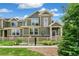 Inviting exterior view featuring a charming home with manicured landscaping and stone accents at 1190 Telleen Ave, Erie, CO 80516