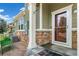 Close-up view of the cozy front porch with a decorative welcome mat and exterior details at 1190 Telleen Ave, Erie, CO 80516