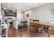 Modern kitchen featuring stainless steel appliances, a granite countertop island, and sleek dark cabinetry at 1190 Telleen Ave, Erie, CO 80516
