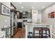 Stylish kitchen featuring stainless steel appliances, granite countertops, and a convenient breakfast bar at 1190 Telleen Ave, Erie, CO 80516