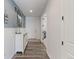 Bright entryway with modern flooring, leading to the rest of the home at 9835 Uravan St, Commerce City, CO 80022